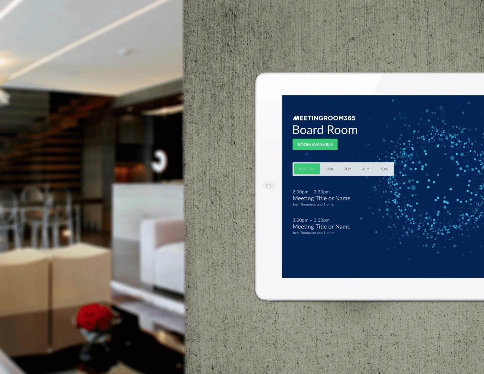 iPad mounted on a concrete wall showing the Board Room display as available