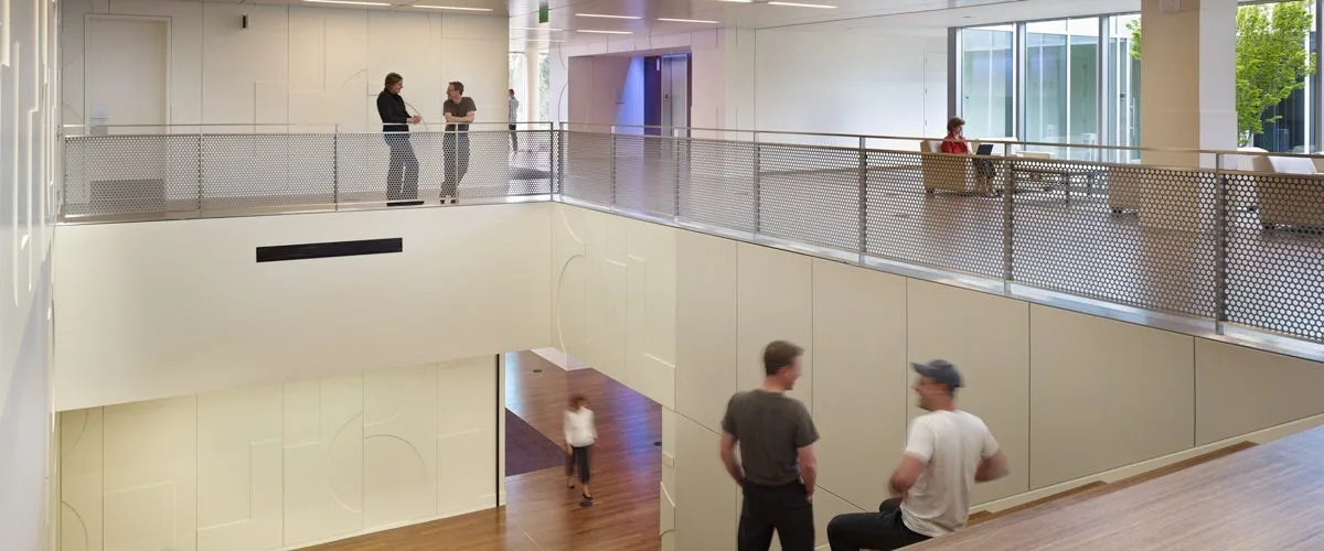 Open atrium inside the Nintendo offices with people on a walkway above