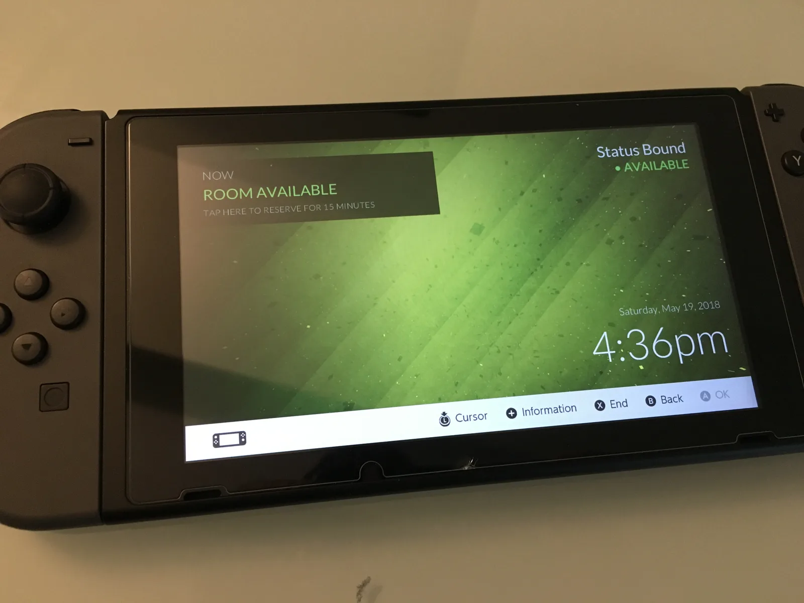 Nintendo Switch showing the loaded meeting room display with the room available