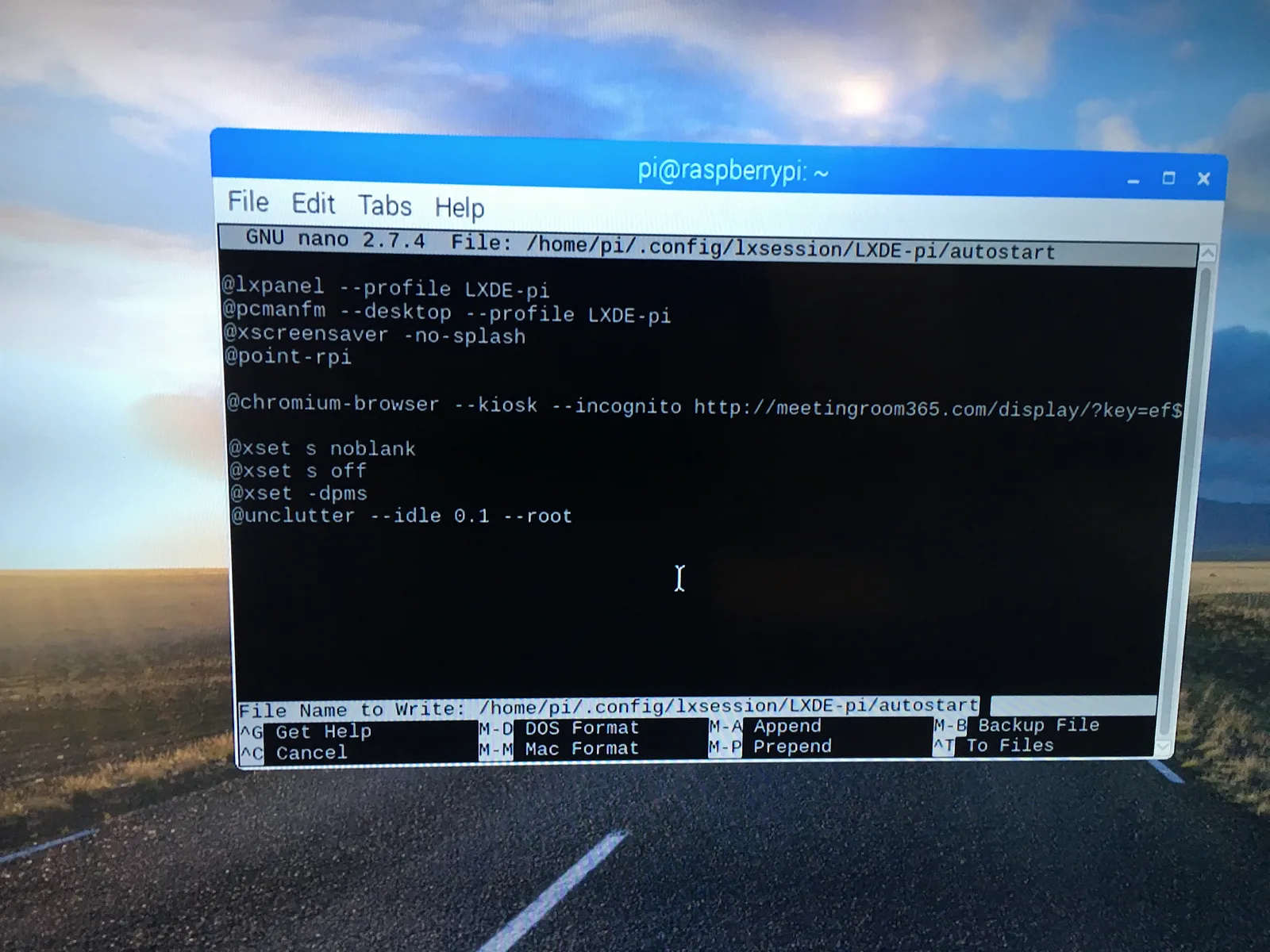 Nano editing the LXDE autostart file to launch Chromium in kiosk mode at the display URL
