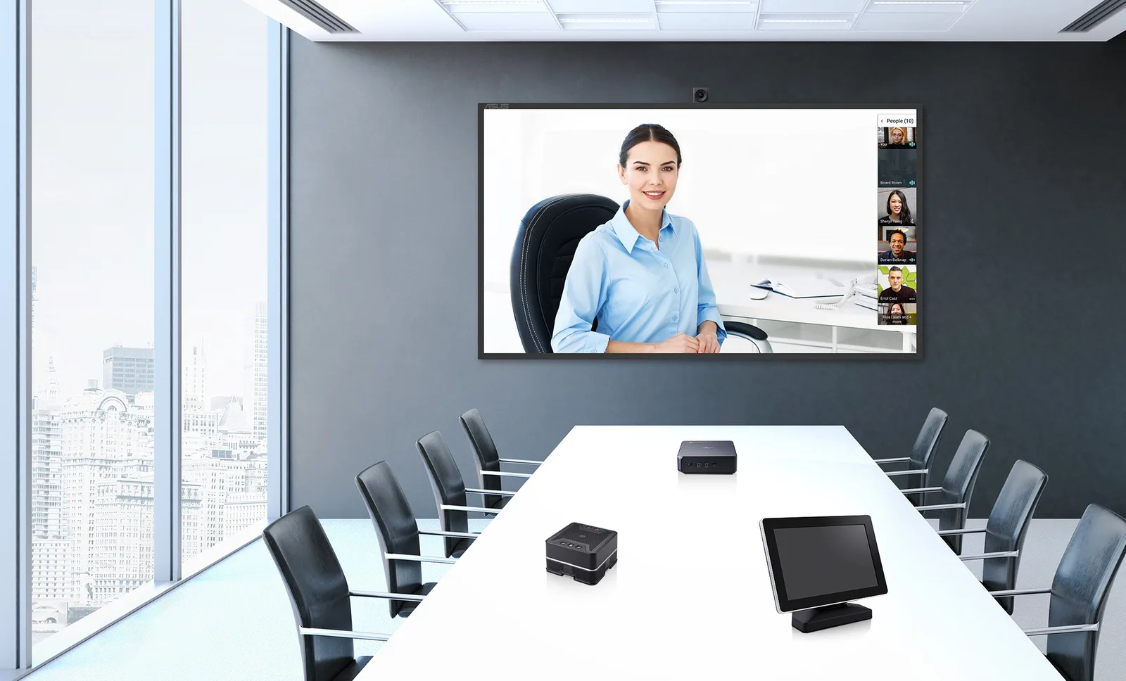 Modern boardroom with a video call on the wall display and a touch console on the table