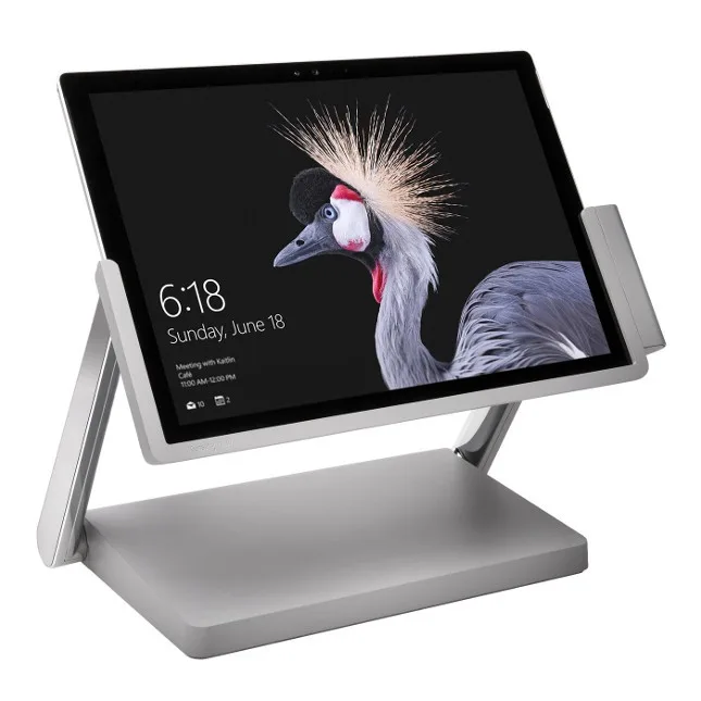 Surface tablet mounted on a docking stand showing the lock screen